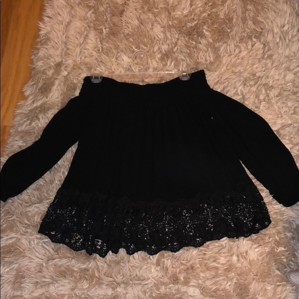 Black off the shoulder shirt w/ lace at the bottom